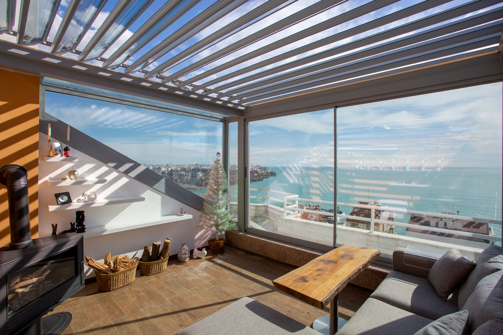 Aspendos Glass interior with glass louvered roof and sea view